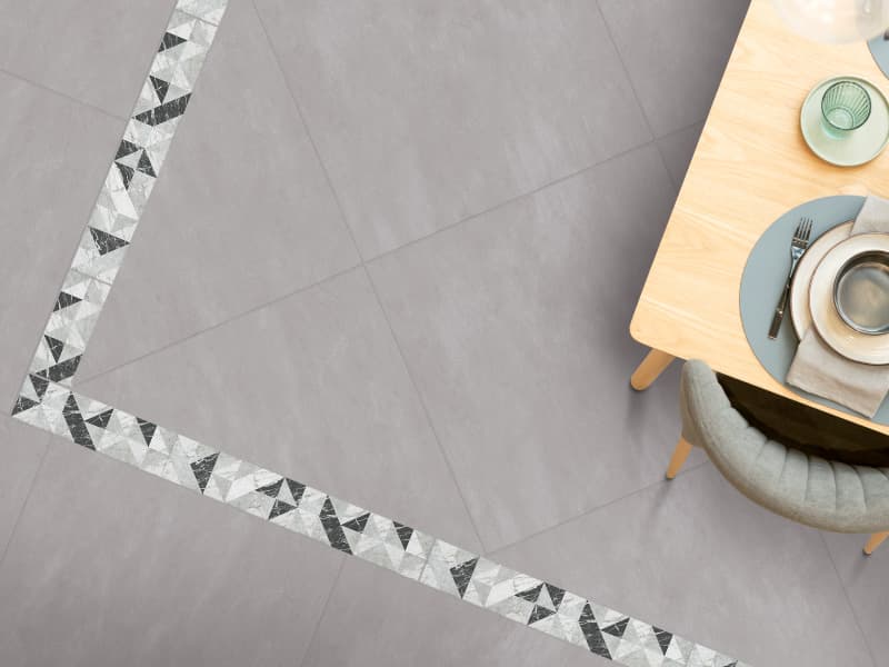 Comedor con diseño contemporáneo y detalles en el piso